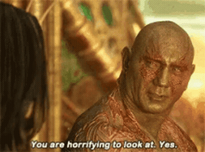 Bald Man Talking To Woman In Movie GIF
