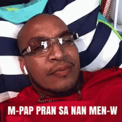 Bald Man Wearing Glasses Lying On Blanket GIF