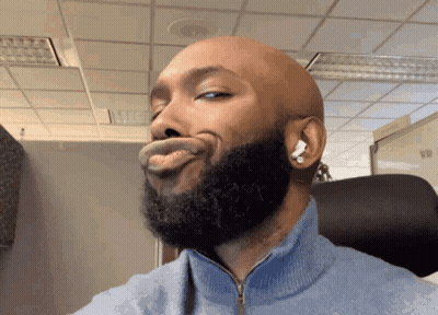 Bald Man With Beard And Earbuds GIF