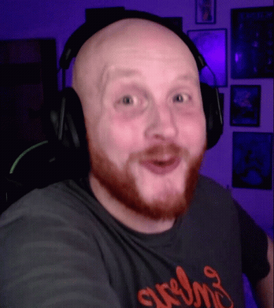Bald Man With Beard And Headphones In Srem Shirt GIF