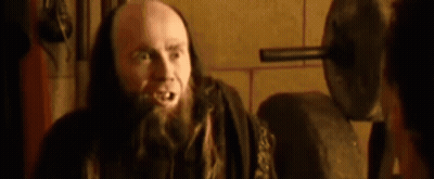 Bald Man With Beard And Long Hair Talking To Another Man GIF