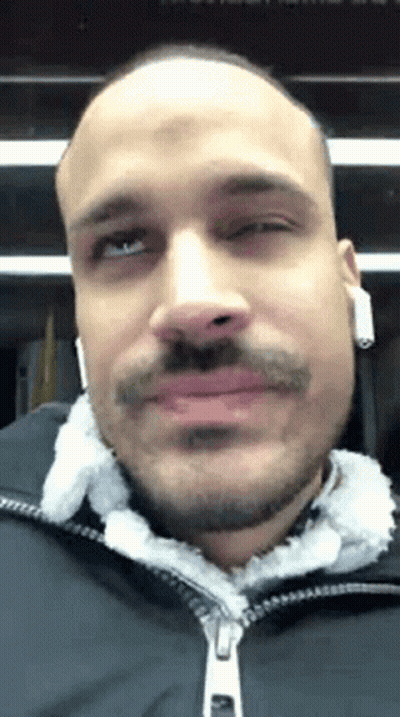 Bald Man With Beard And Mustache Wearing Headphones And Black Jacket GIF