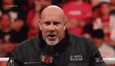 Bald Man With Beard At Microphone GIF