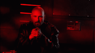 Bald Man With Beard In Black Leather Jacket Red Lights GIF