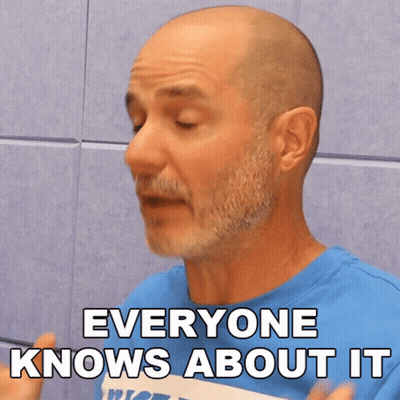Bald Man With Beard In Blue Shirt Saying Everyone Knows About It GIF