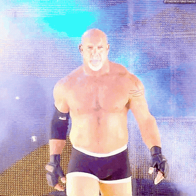 Bald Man With Beard In Front Of Blue Background GIF
