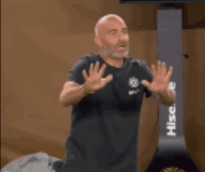 Bald Man With Beard In Front Of Hisense Machine GIF