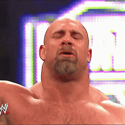 Bald Man With Beard In Front Of WWE Logo GIF