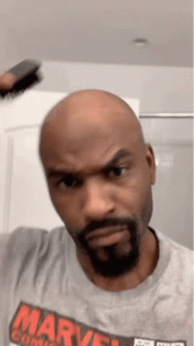 Bald Man With Beard In Gray Marvel Shirt GIF