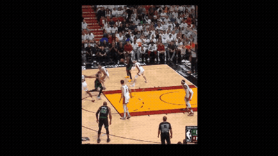 Bald Man With Beard In Green Jersey Smiling In Crowd GIF