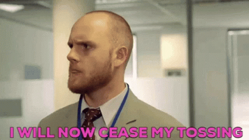 Bald Man With Beard In Suit Saying I Will Now Cease My Tossing GIF