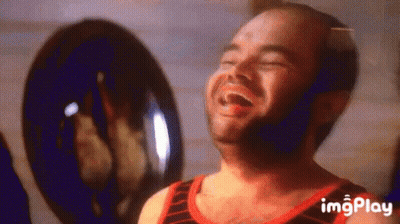 Bald Man With Beard Laughing Eyes Closed In Front Of Fan GIF
