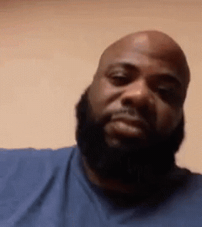 Bald Man With Beard Looking At Camera GIF