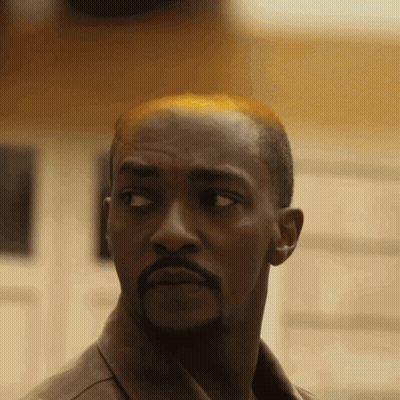 Bald Man With Beard Looking At Camera GIF