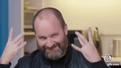 Bald Man With Beard Making Funny Face And Peace Sign GIF