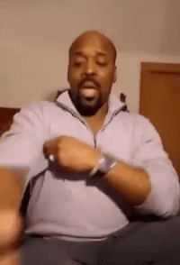 Bald Man With Beard On Couch Wearing Watch GIF