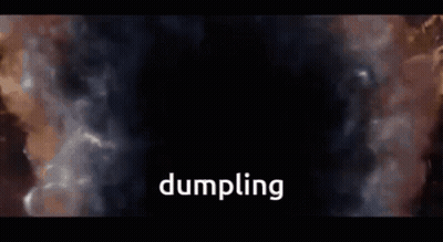 Bald Man With Beard Sitting In Front Of Lit Wall GIF