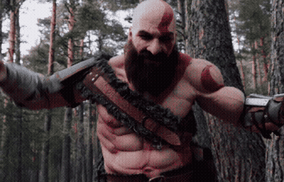 Bald Man With Beard Standing In Woods GIF