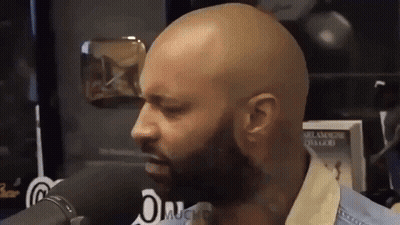 Bald Man With Beard Talking Into Microphone GIF