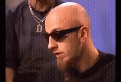 Bald Man With Beard Wearing Sunglasses And Necklace GIF