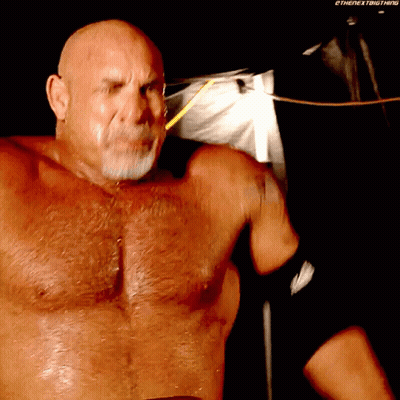 Bald Man With Beard Without Shirt In Dark Room GIF