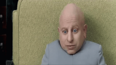 Bald Man With Blue Eyes Looking At Camera GIF