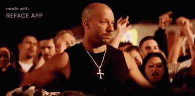Bald Man With Cross Necklace At Concert GIF