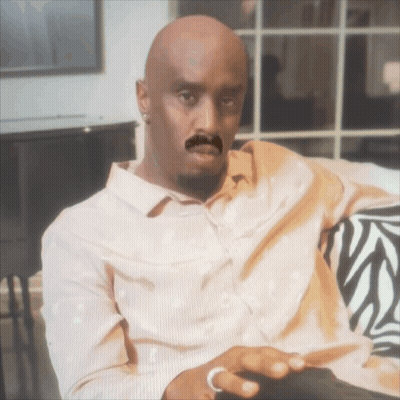 Bald Man With Fake Mustache Sitting On Zebra Couch GIF