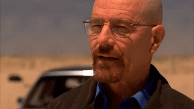 Bald Man With Glasses And Beard In Desert GIF