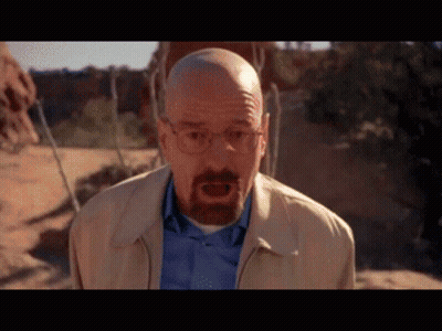 Bald Man With Glasses And Beard In Tan Jacket And Blue Shirt GIF