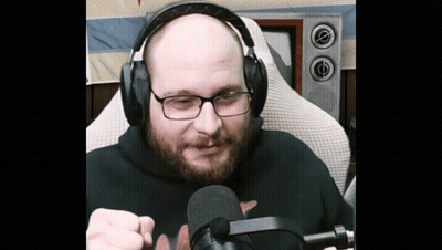 Bald Man With Glasses And Headphones Holding Microphone GIF