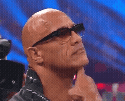 Bald Man With Glasses And Leather Jacket Hand On Chin GIF