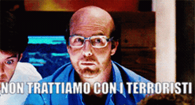 Bald Man With Glasses In Blue Shirt Says Non Trattiamo Con I Terroristi GIF