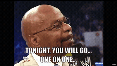 Bald Man With Glasses Talking Into Microphone GIF