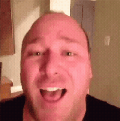 Bald Man With Mouth Open And Tongue Out GIF