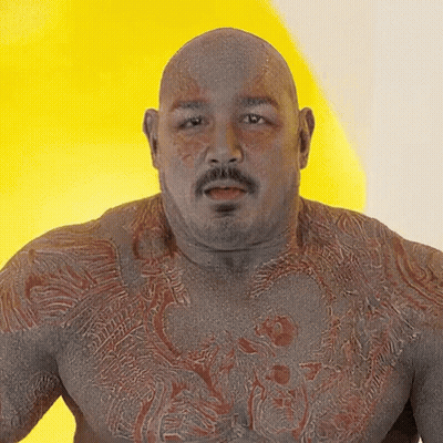 Bald Man With Mustache And Chest Tattoo GIF