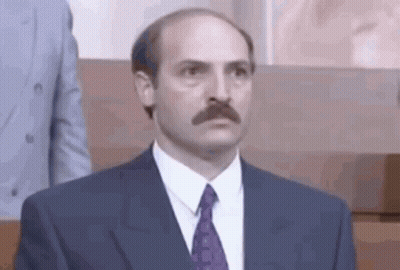 Bald Man With Mustache In Suit And Tie GIF