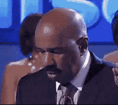 Bald Man with Mustache in Suit and Tie