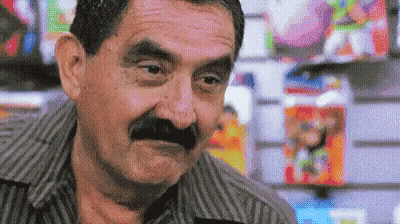 Bald Man With Mustache In Suit Making Funny Face GIF