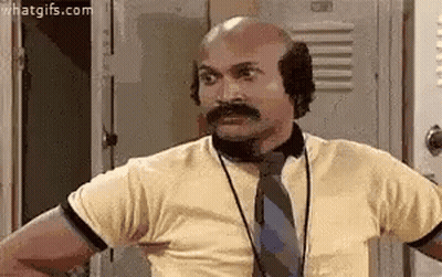 Bald Man With Mustache In Tie And Ear Muffs GIF