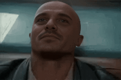 Bald Man With Mustache Looking Up GIF