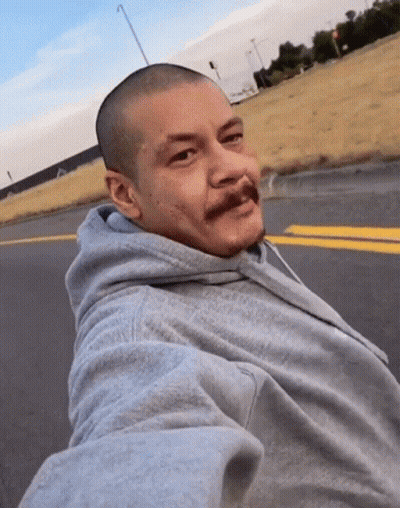 Bald Man With Mustache Taking Selfie On Road GIF