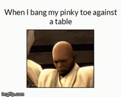 Bald Man With Pinky Toe Against Table GIF