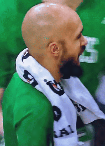 Bald Man With Scarf And Green Shirt Number 5 GIF