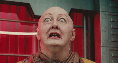 Bald Man With Scarf Looking Up GIF