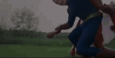 Bald Mustached Man In Suit Covering Mouth GIF
