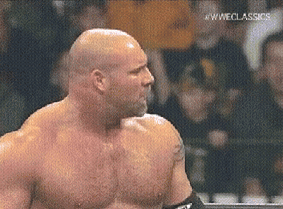 Bald Wrestler Standing In Ring Before Crowd GIF
