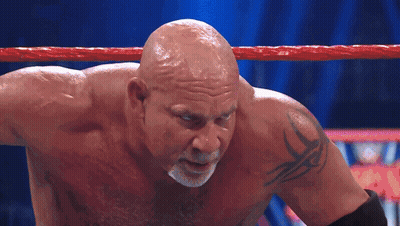 Bald Wrestler With Arm Tattoo In Ring GIF