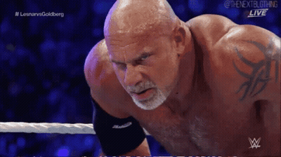 Bald Wrestler With Arm Tattoo In Ring GIF