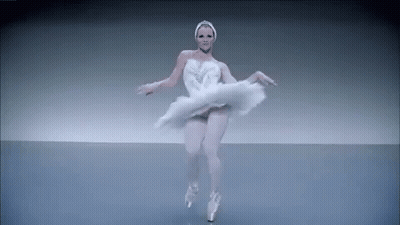 Ballerina In White Swan Dress Dancing On Stage GIF